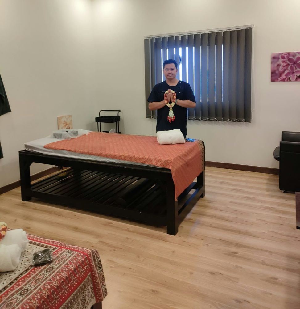 Therapist welcoming guests in a treatment room
